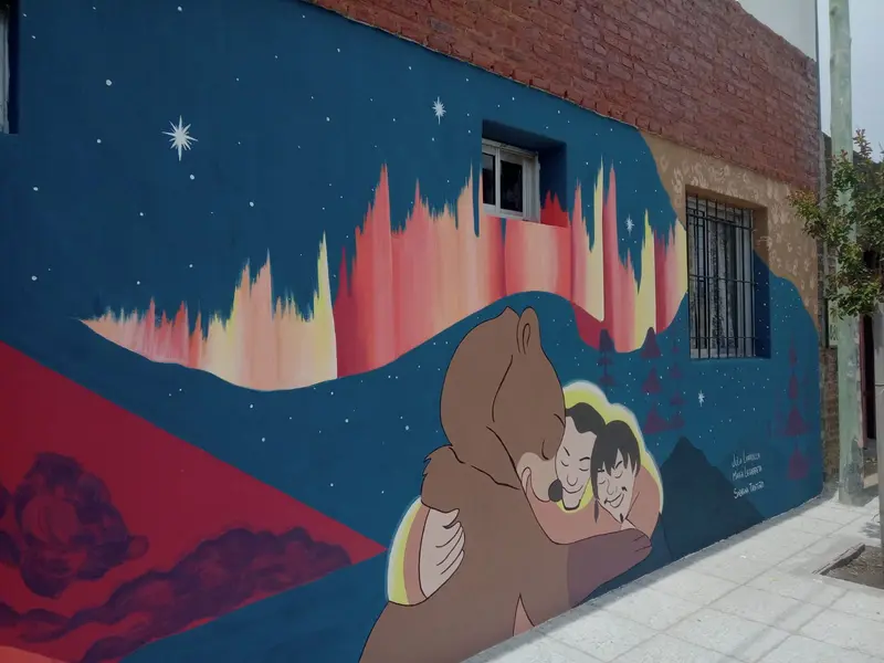 Detalle del abrazo y las firmas